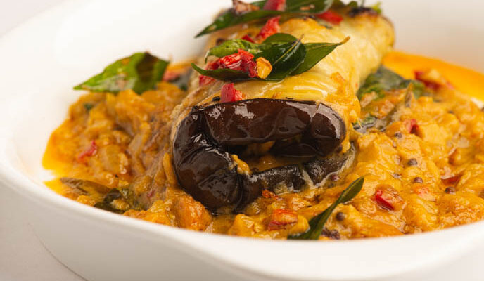 Stuffed Eggplant in Curry And Coconut Dal
